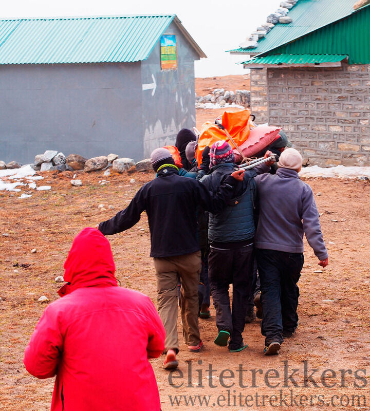 Injured climber being carried