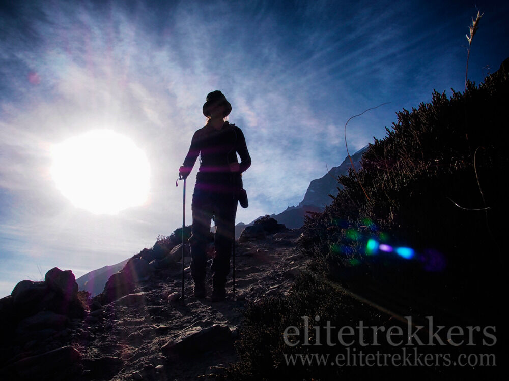 Trekker descending at sunset